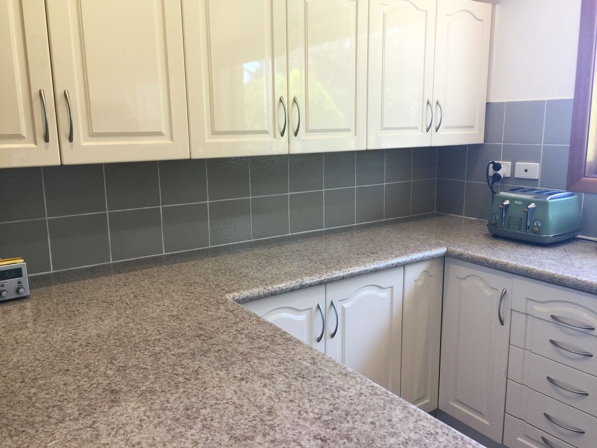 This was our original Kitchen, however just to make it look a little bit better, we painted the wall tiles as a temporary fix