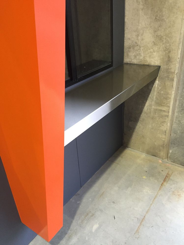 Stainless steel bench at enquiry window