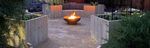 Circular raised planters with seating fire pit.JPG