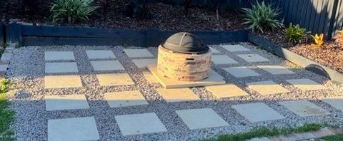 Fire pit area with pavers and stones.jpg