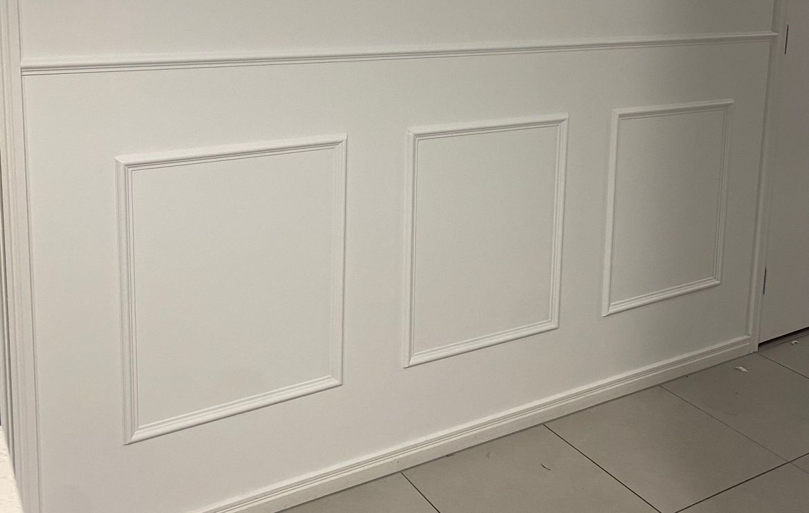 DIY wainscotting project using Pine moulding.jpeg