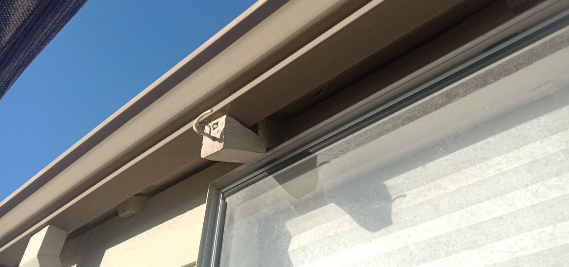 Close up of rafters that have been cut to accommodate gutter and windows.