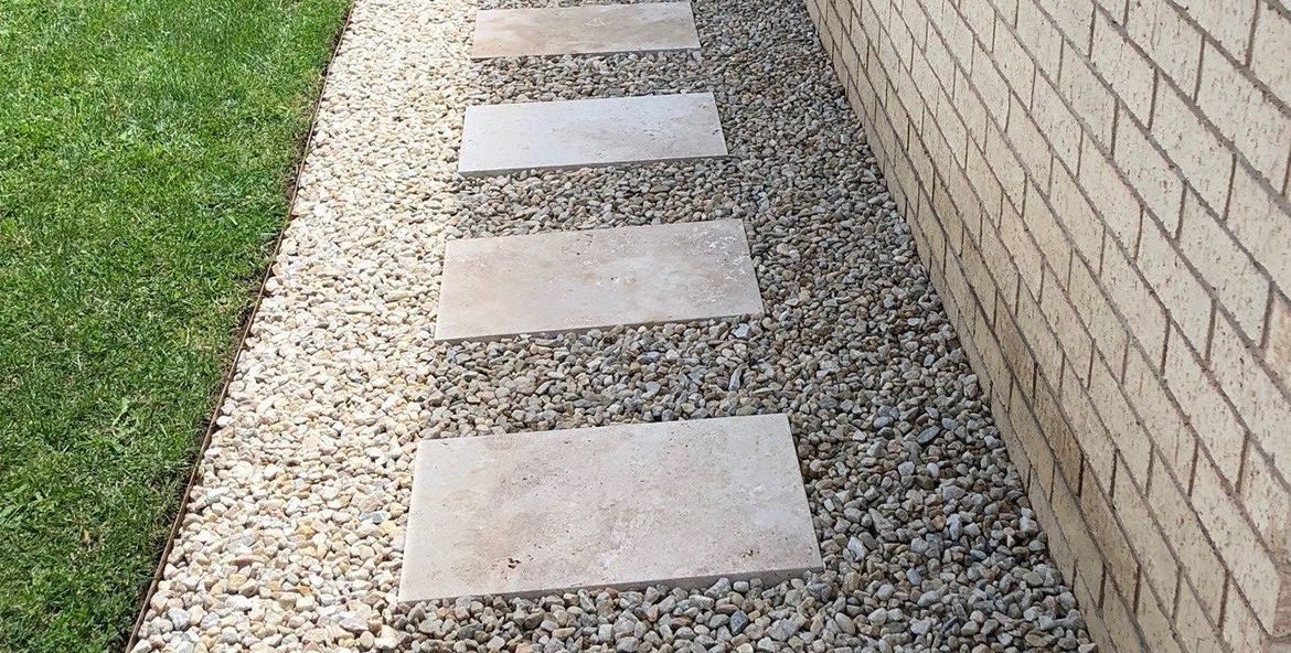 Travertine pavers and gravel garden path.jpeg