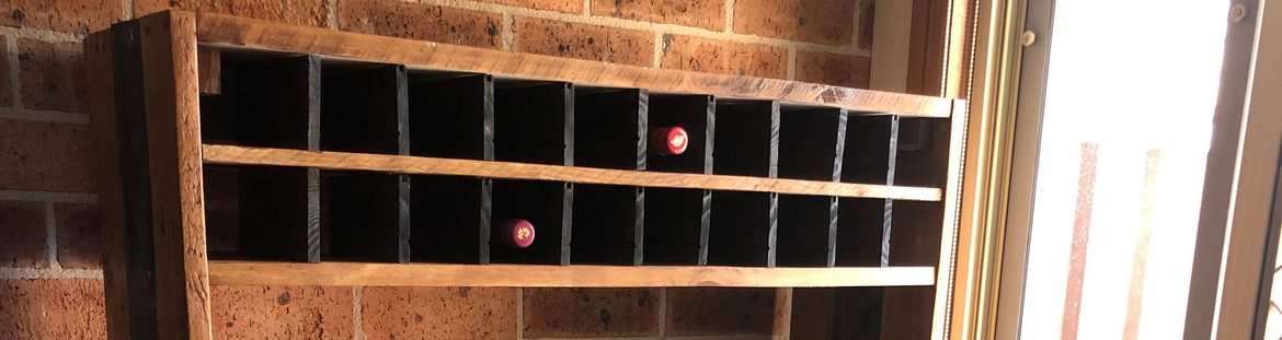 Kitchen storage cupboard with wine rack.png