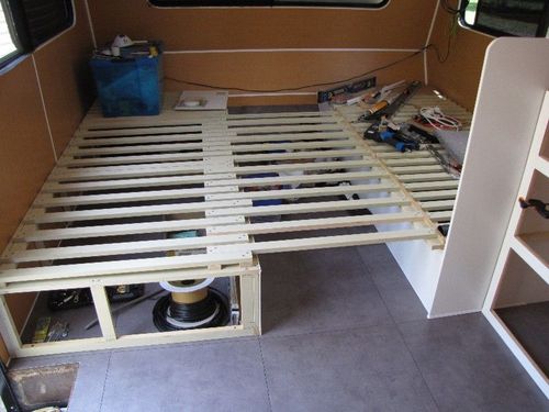 I then built a second bed opposite with just a plain slat top, also hinged for access underneath..