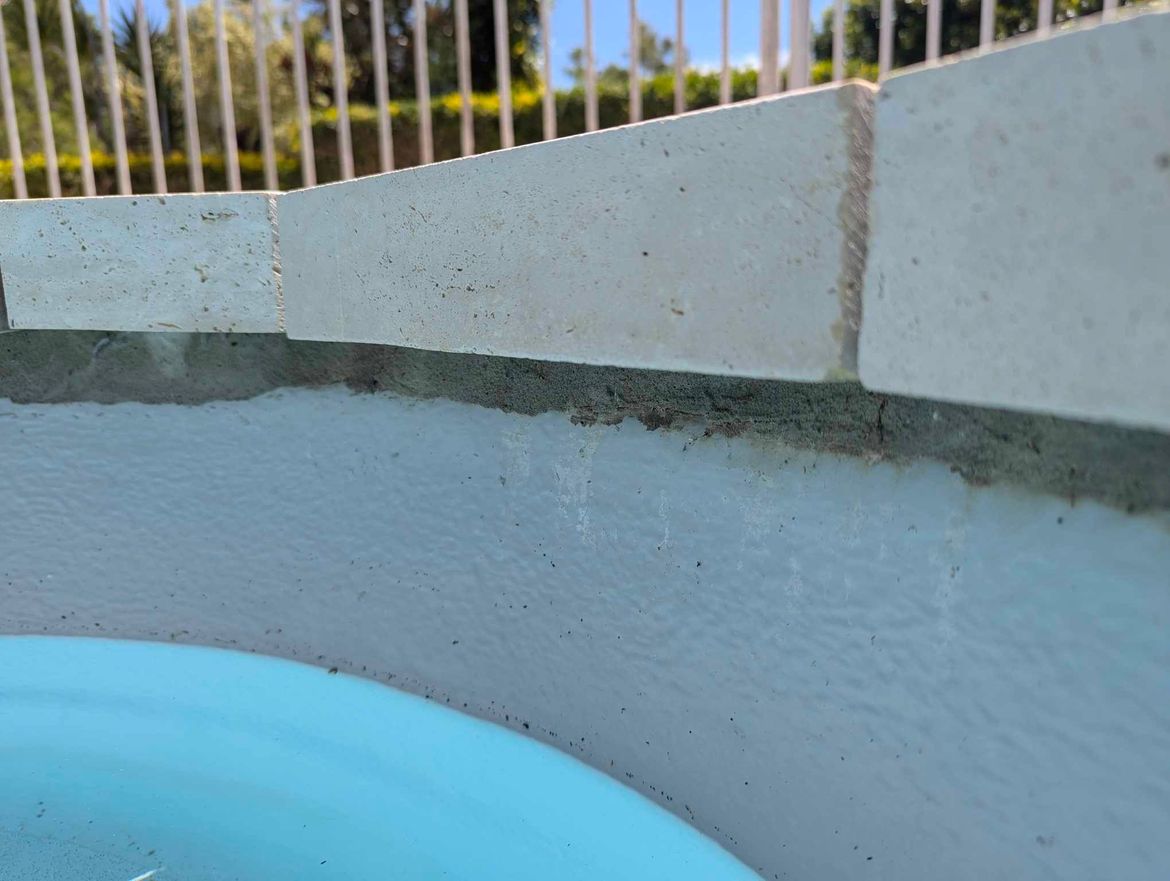 Bedding cement at top of pool, under paver