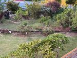 Fissures in the lawn, pressure on the wooden retaining wall