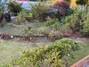 Fissures in the lawn, pressure on the wooden retaining wall