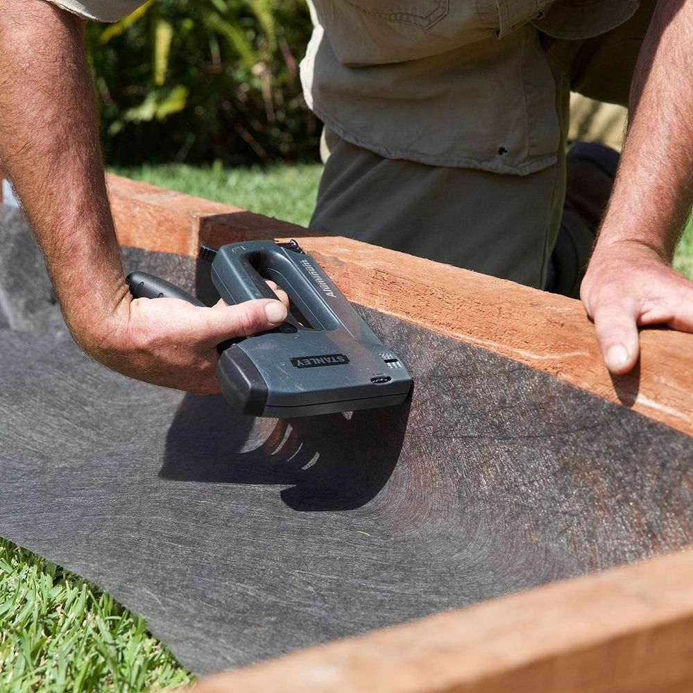 6. Cut weed mat into strips and staple to secure.jpg