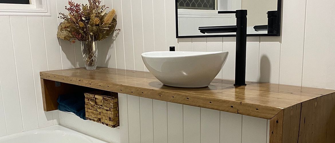 Bathroom reno with timber benchtop and VJ panelling.jpg