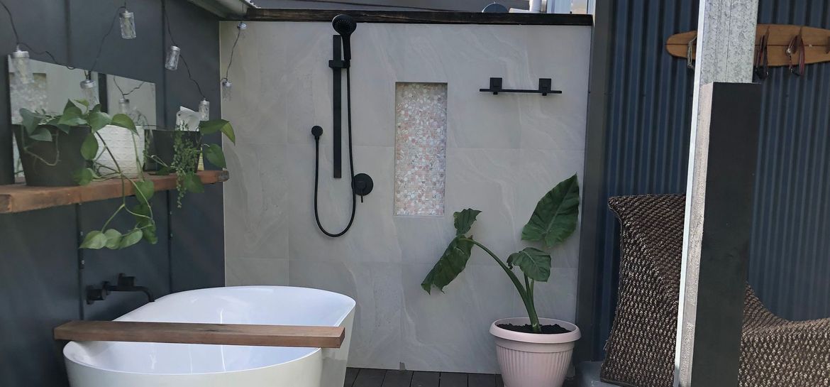  Outdoor bathroom with freestanding bath.jpeg