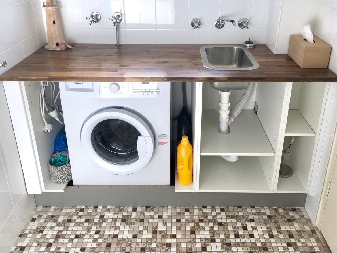 How to Hide a Washer and Dryer in the Kitchen with Style and Function