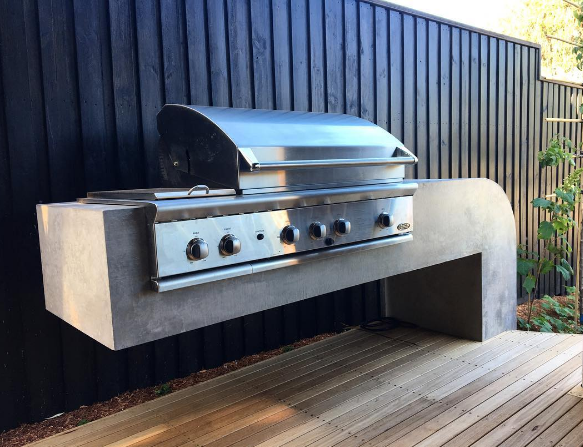 Cantilevered concrete BBQ bench impressionslandscapedesign.png