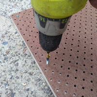 8.7 Attaching pegboard to surround with screws.png