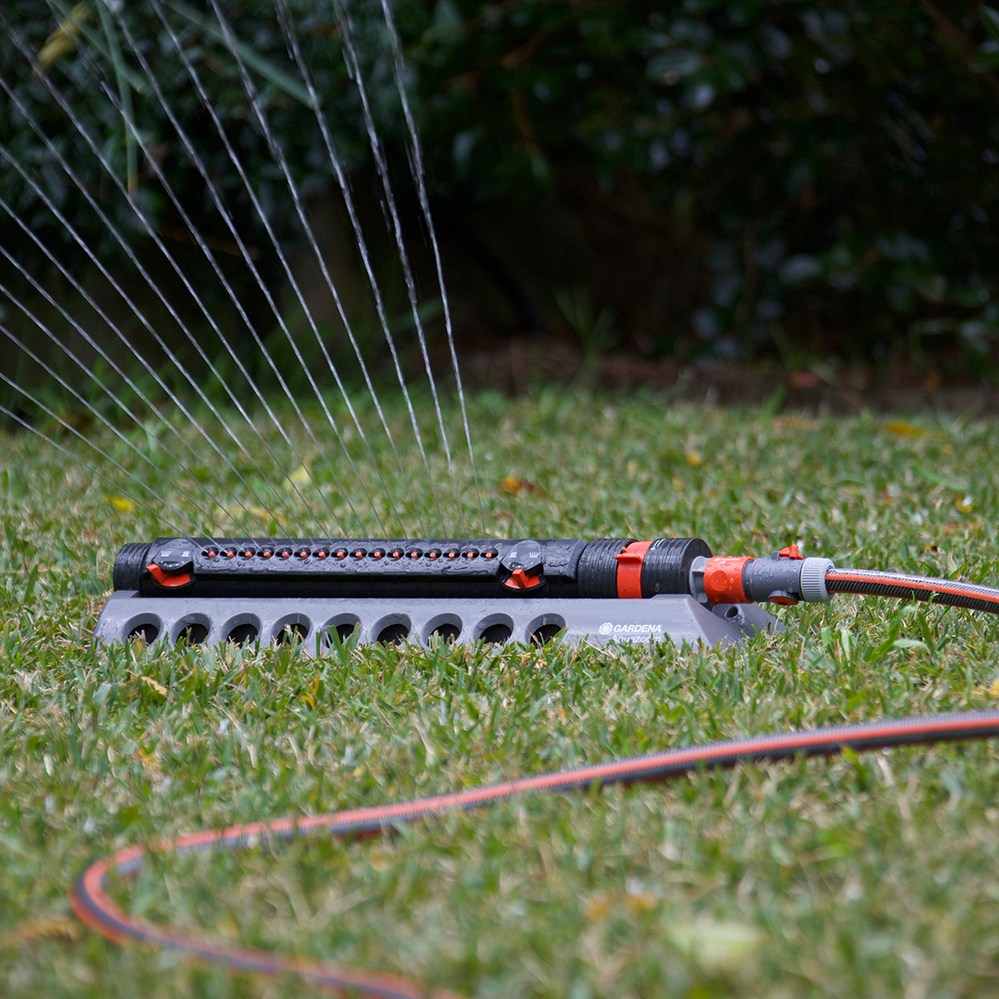 A sprinkler with adjustable throw makes watering more efficient.