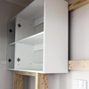 Rufaro built a timber frame to mount storage units in his laundry