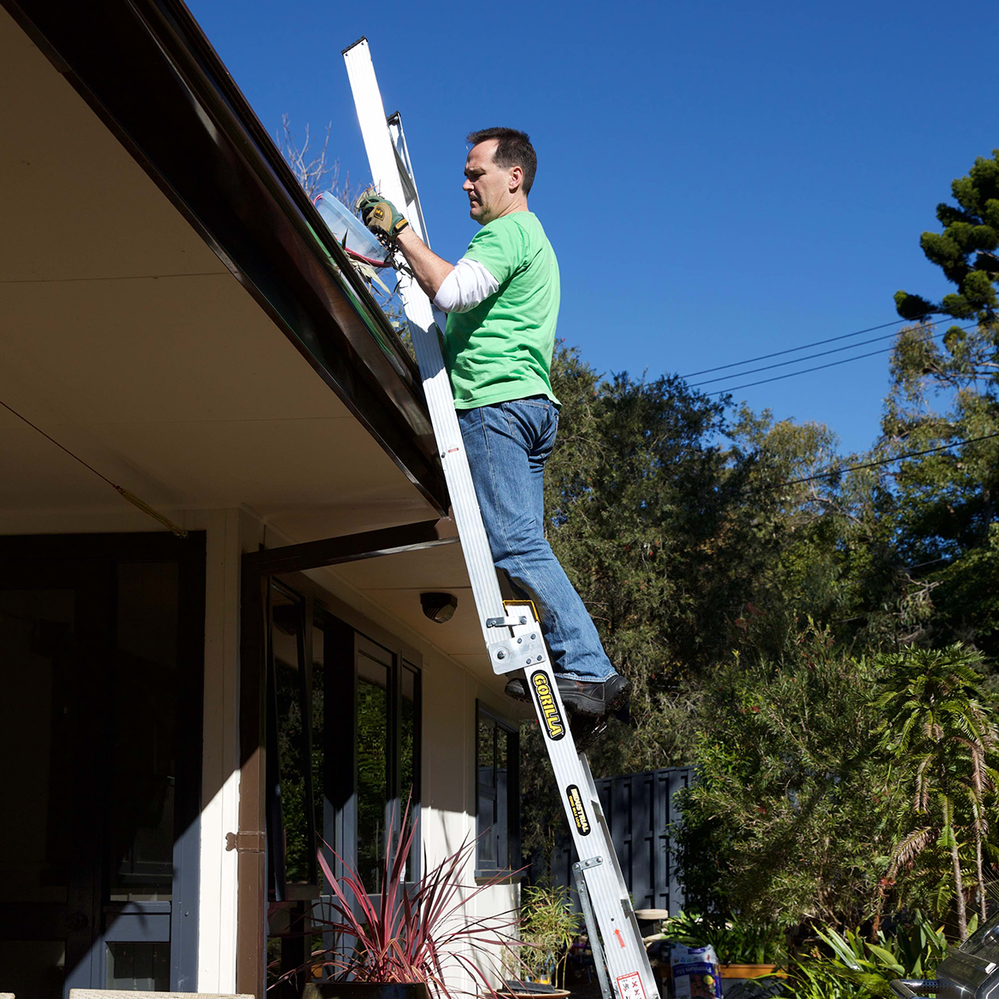 A multipurpose ladder folded out to use as a straight ladder.png