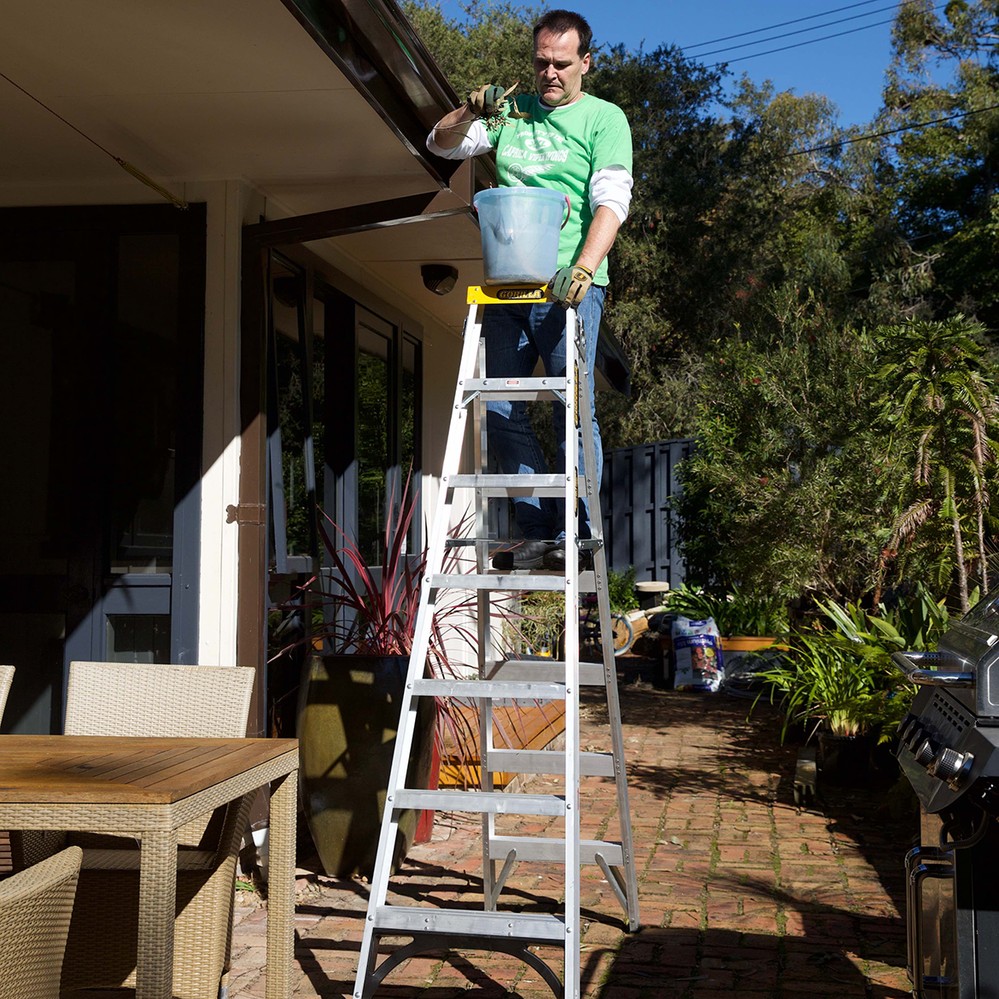 A multipurpose ladder used open as a double sided step ladder.png