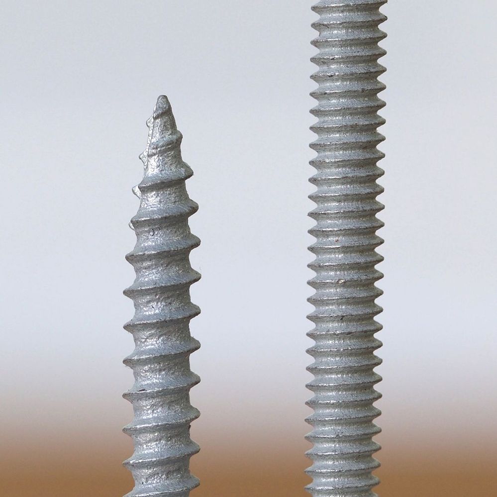 Coarse timber thread and fine metal thread screws