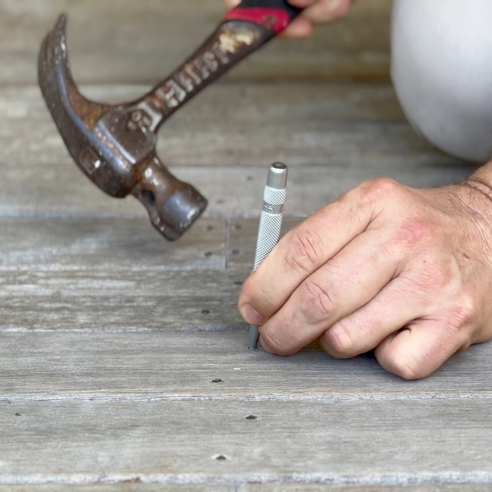 4. Punch down any raised nails.png