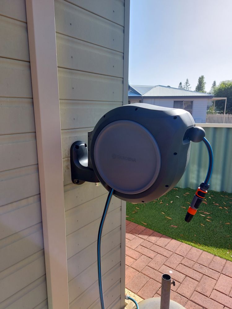 How to mount a Gardena hose reel to clad