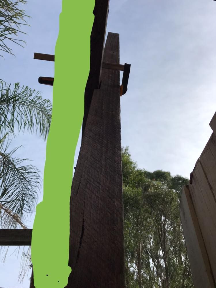 So the green line is roughly true verical, the bow in the crossbeam caused the post to be out so far. (There is also a bow in the tall post but not too bad)