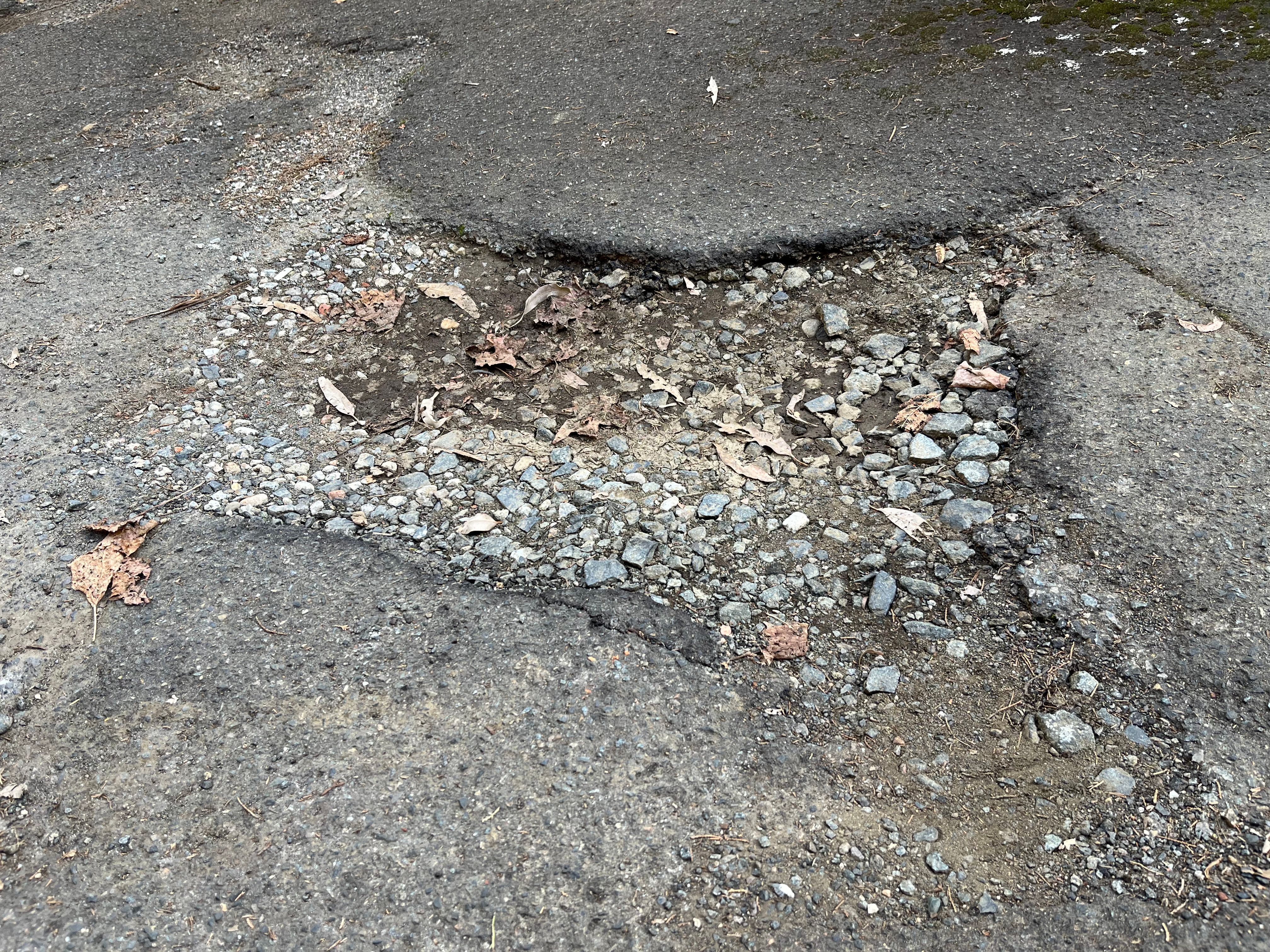 How to repair potholes in driveway?