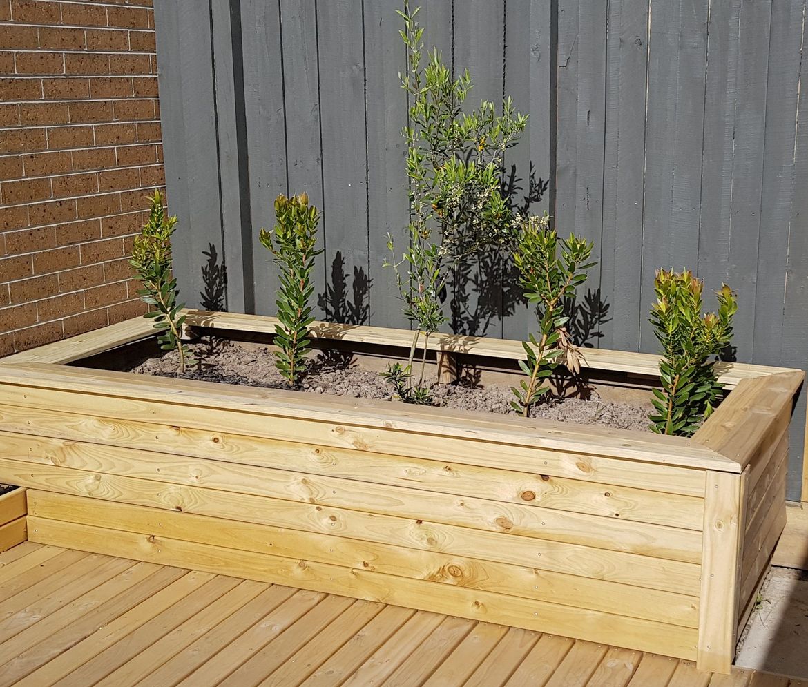 Traditional treated pine sleepers were clad with decking boards