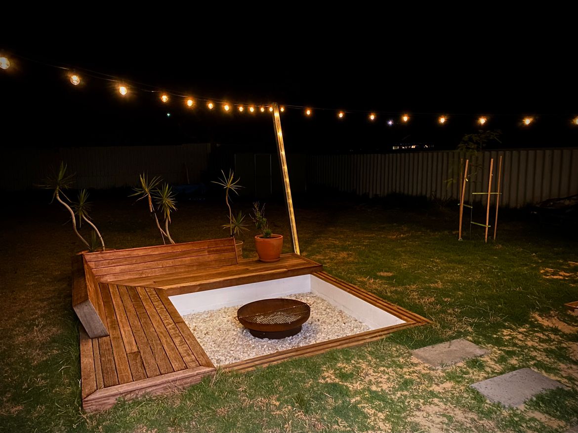 Sunken seating area outlet with fire pit