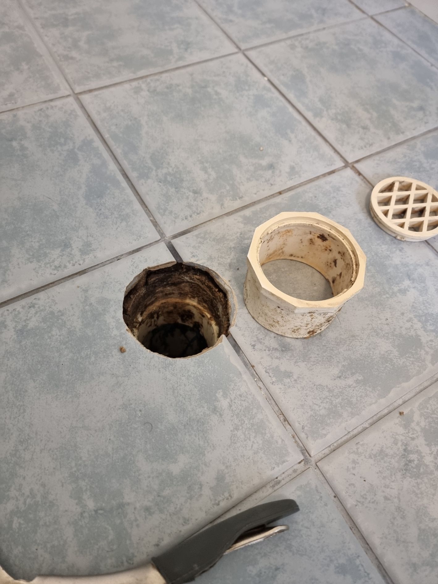 Shower floor deals drain repair